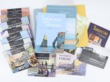a lot of books that are sitting on a table