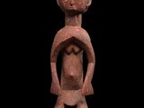 une image représentant une figurine en argile d'un homme tenant un bébé dans ses bras