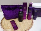 purple and black items sitting on top of a basket on a table