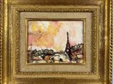 un tableau représentant la tour Eiffel est présenté dans un cadre doré