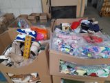 two cardboard boxes filled with shoes and other items