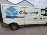 a picture of a white van parked in a parking lot