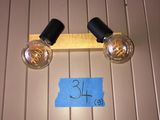 two light bulbs that are attached to the wall