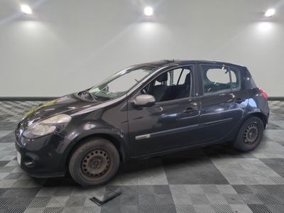 a picture of a small black car parked in a garage