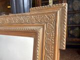 a picture of a picture of a gold frame on the floor