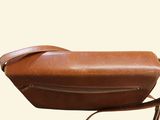 a brown leather bag with a strap on it