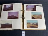 an open book with pictures of mountains and trees on it