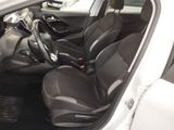 the interior of a white car with black seats and a steering wheel