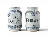 pair of blue and white vases with floral designs on them