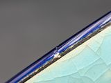 a close up view of a blue and white surfboard