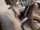 many bikes that are parked next to each other on the street