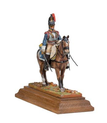 statue of a man in uniform riding a horse on a wooden base