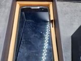 a box with a cell phone inside of it