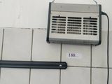 a small air conditioner on the wall next to a heater