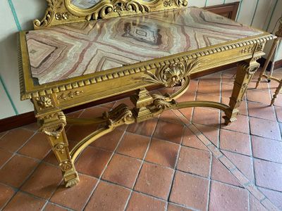 a table with a mirror on top of it in a room