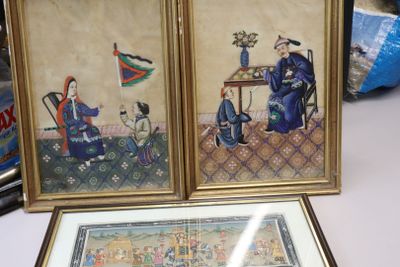 two framed pictures of a man and a woman sitting at a table