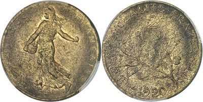 a gold coin with an image of a woman and a dog on it