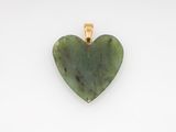 a green jade heart pendant on a white background