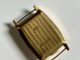 a close up of a gold watch on a white surface