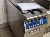 a kitchen with a sink and a dishwasher in it