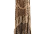 a dress on a mannequin stand with a white background