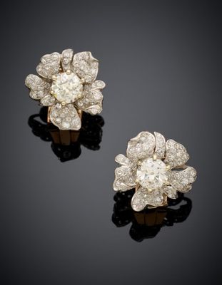a pair of diamond ear clips