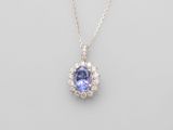 a tanzanite and diamond pendant on a chain