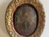 a picture of a picture of a picture of jesus in a gold frame