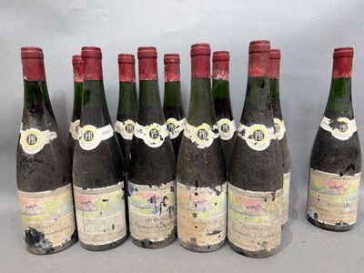 six bottles of wine are lined up in a row on a table