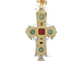 an image of a gold cross with red and green stones on it