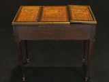 an old wooden table with two drawers and a drawer on top
