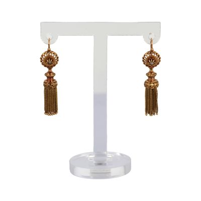 a pair of gold earrings with tassels hanging from them