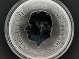 Gros plan sur une pièce de monnaie portant le visage d'un homme