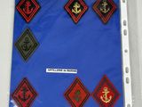 a picture of a folder with a lot of patches on it