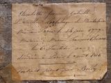 a piece of paper with writing on it sitting on a table