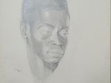 dessin au crayon représentant le visage d'un homme sur une feuille de papier