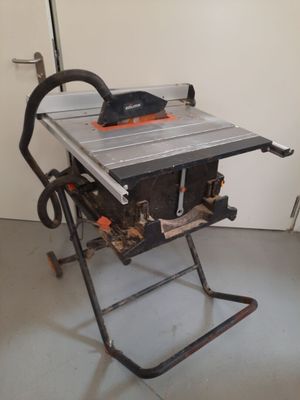 a table with a saw on it in a room