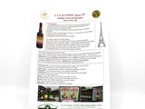 a menu with a picture of the eiffel tower and a bottle of wine