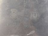 a silver plate with a picture of a man and a woman on it
