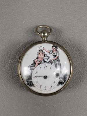 a clock with a picture of a woman and a man on it