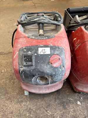 two red and black vacuums sitting next to each other