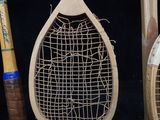 several tennis rackets are lined up against a black background