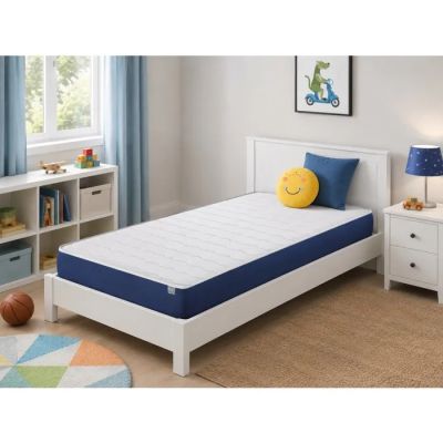 un lit blanc sur lequel est posé un oreiller en forme de smiley