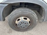 a close up of a flat tire on a truck
