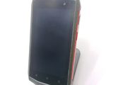 a cell phone that is sitting on top of a stand
