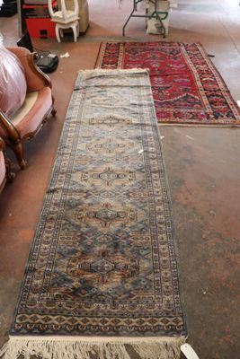 a long rug on the floor in a room