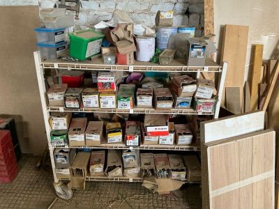 a cart full of boxes and other items in a room