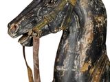 a wooden horse with a long mane on a white background