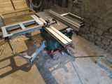 a picture of a table saw in a workshop