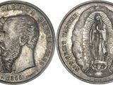 a silver coin with an image of the virgin of guadalupe on it